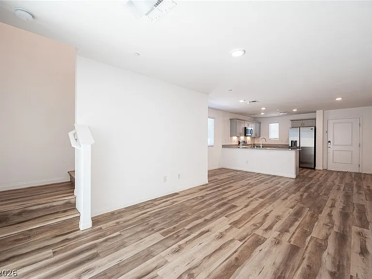 Living room: Bright open-concept living area with modern flooring.