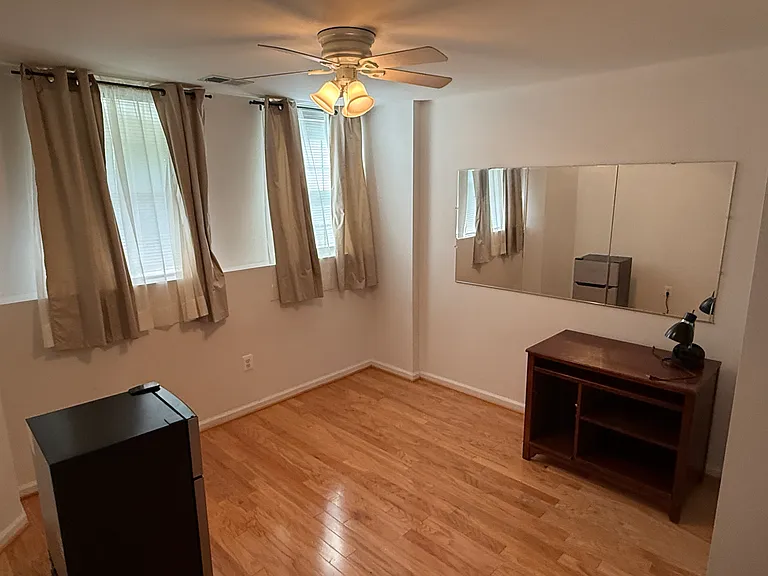 1 bedroom with small fridge, sunlight
