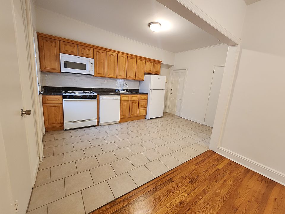 Eat-in kitchen w/ dishwasher & brand new fridge.