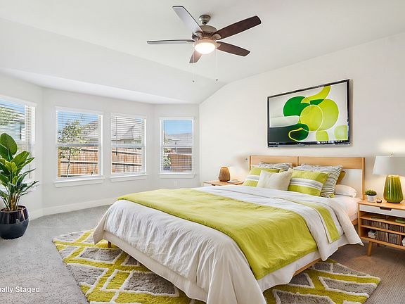 Virtually staged primary suite in the Hughes floorplan at a Meritage Homes community.