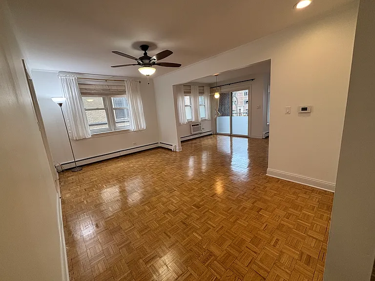Dining room looking into end of living room and private balcony