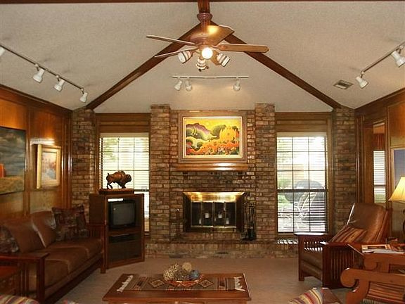 DEN WITH VAULTED CEILING AND FIREPLACE