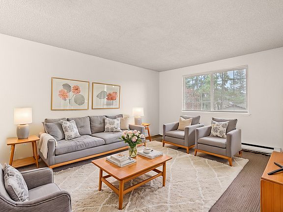 Step into elegance with this inviting living space, beautifully adorned for comfort and style.