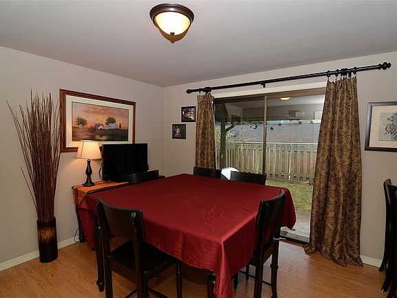 Large dining room also has breakfast bar and leads to covere