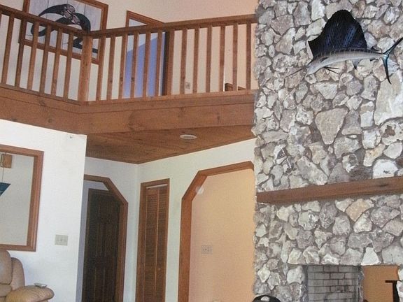 Soaring mantel to beam ceiling