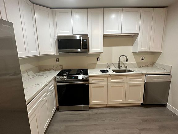 All new, eat-in kitchen with slider on right to private backyard.