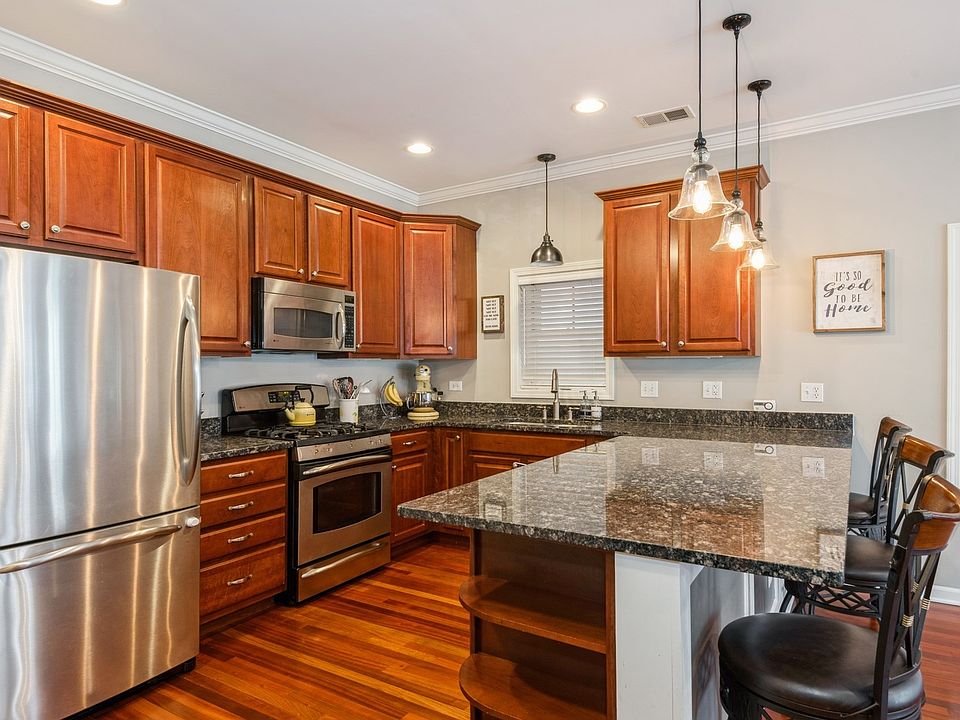 Open chefs kitchen with deep breakfast bar and plenty of counter space