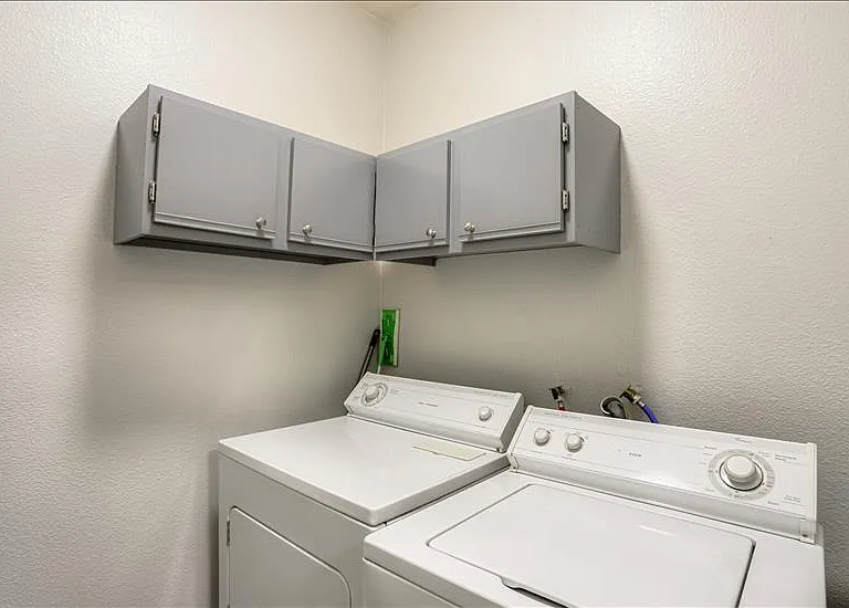 Full Size Washer and Dryer in Laundry Room next to the Kitchen