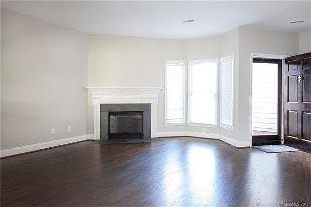 Open living area with natural fireplace
