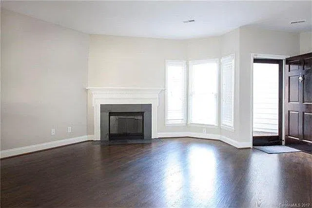 Open living area with natural fireplace