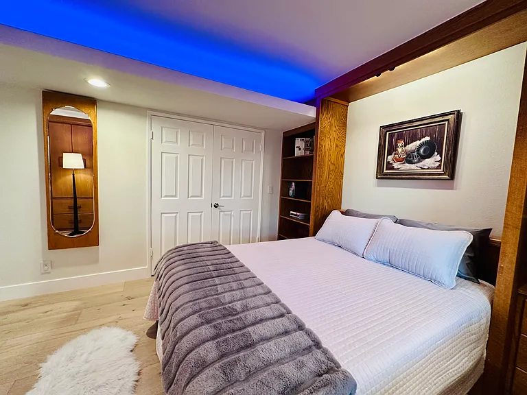 Guest bedroom/ Office with a murphy bed (Queen size), customed desk, shelves and cabinets...