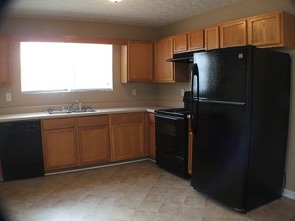 Open kitchen refrigerator, range, venthood, dishwasher