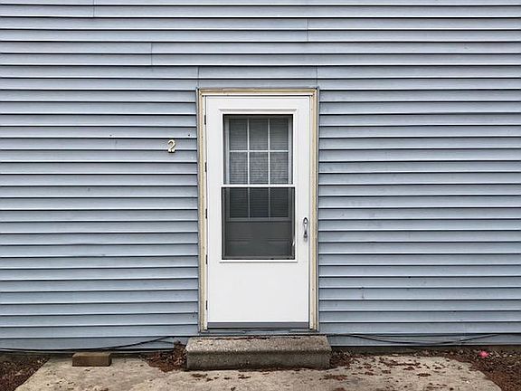 Entry way to apt. 2 with patio.