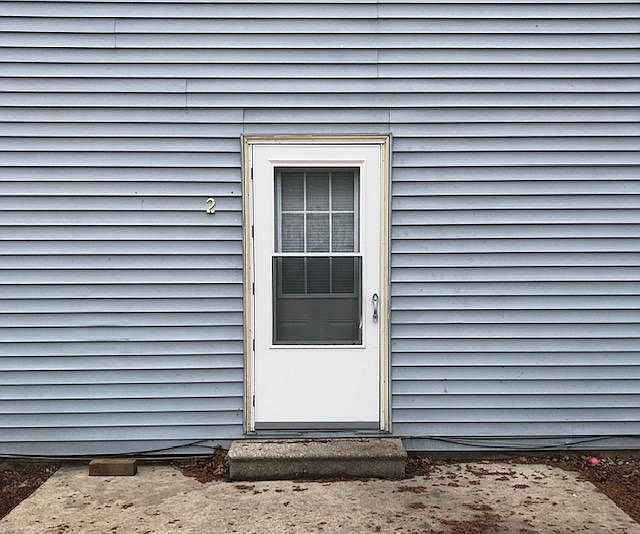 Entry way to apt. 2 with patio.