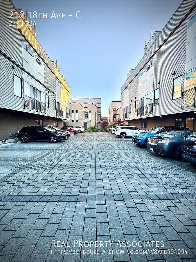 Modern Elegance Meets Urban Comfort Stunning 2 Bed / 2 Bath Townhouse with Rooftop Deck & Gated P... — Photo 2