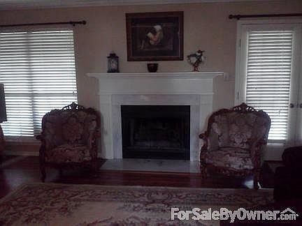 Den
						:
						Has a Fireplace with hardwood floors