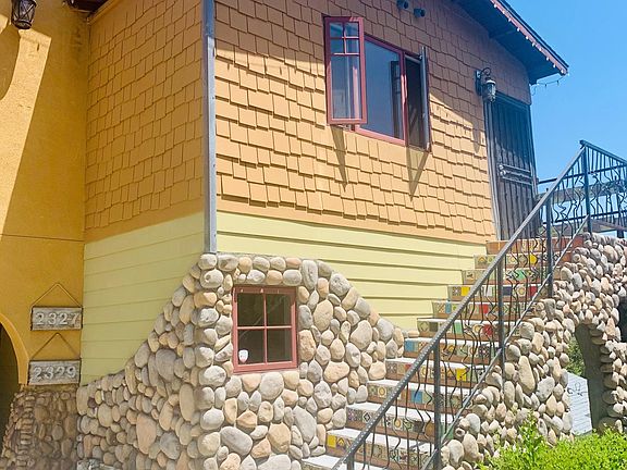 Upstairs house with security screen door.