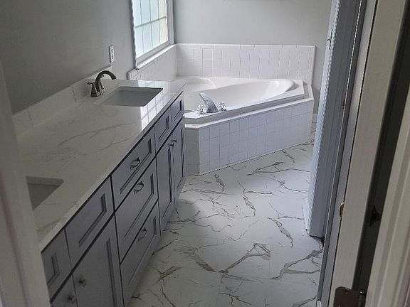 New vanity, quartz top & floor. Separate shower cubicle.