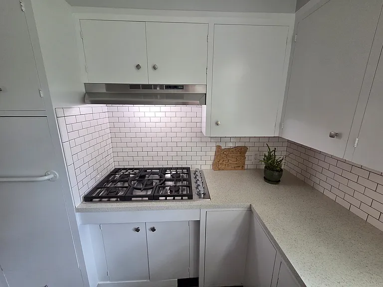 Enjoy convenient cooking with the included gas stove and the plenty of storage this kitchen offers