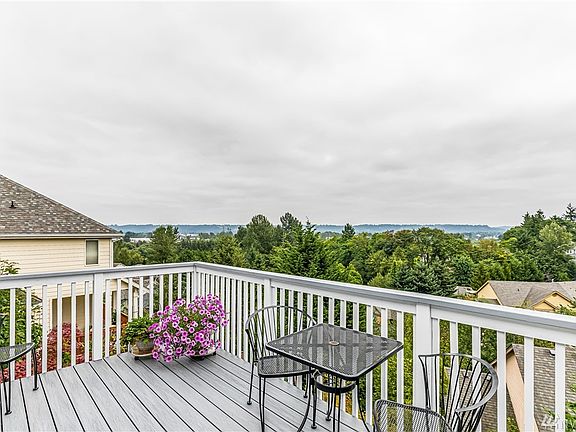 Upper Level Deck - Located off Dining Room & Kitchen - View to the North of Surrounding Mountains & Valley. Updated Deck with No Maintenance Wolf Composite Decking! The Weather was not cooperating during Photo Shoot - See Additional Photos.