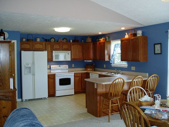 Equipped kitchen includes a smooth top range and referigerator