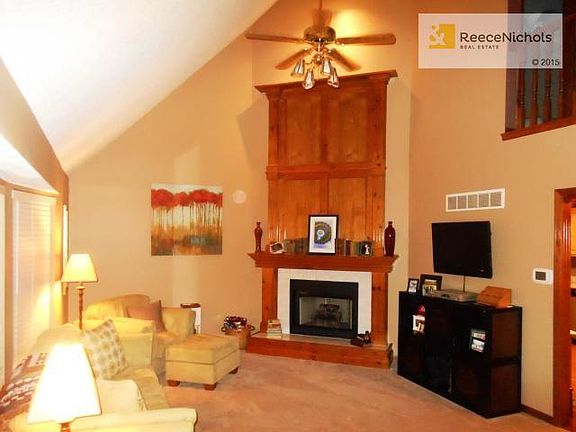 Living Room with Newer pattered carpet. ALL the upgrades and wo