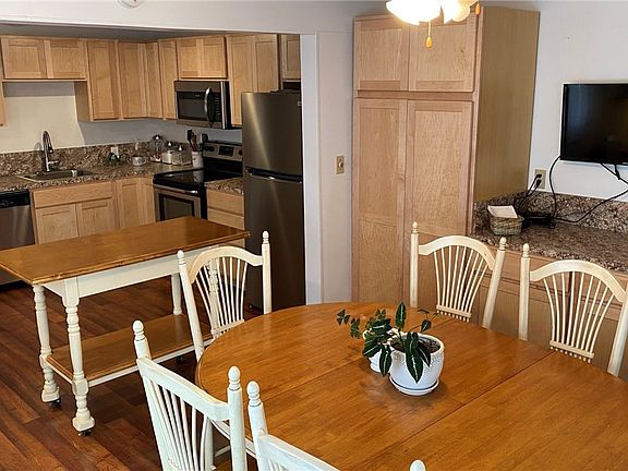 Ample cabinet space with a useful coffee bar or buffet bar.