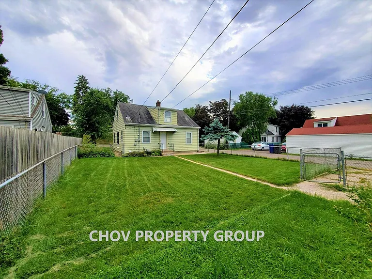 REAR HOUSE VIEW WITH FENCED IN YARD