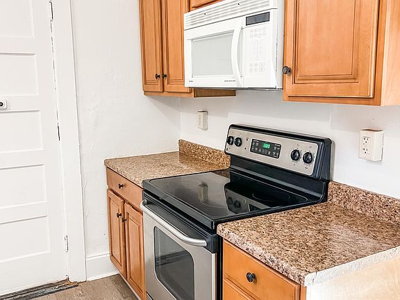 Another view of the kitchen with new range and new floor.