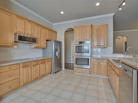 Spacious kitchen with an abundance of cabinets and counter space.