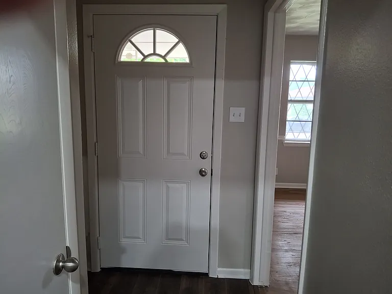 Interior view of front door. Front room to right.