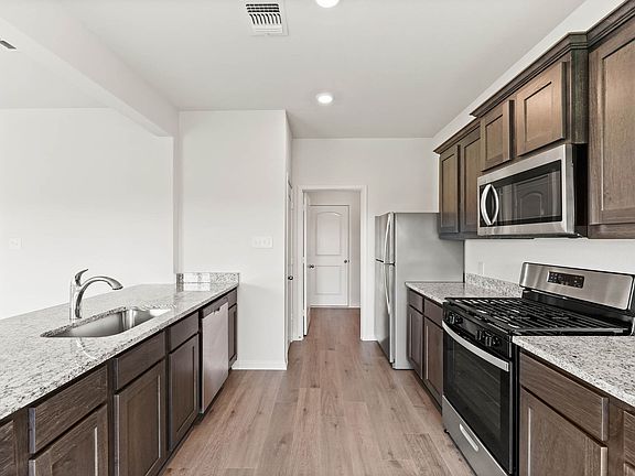 The kitchen has energy-efficient appliances.