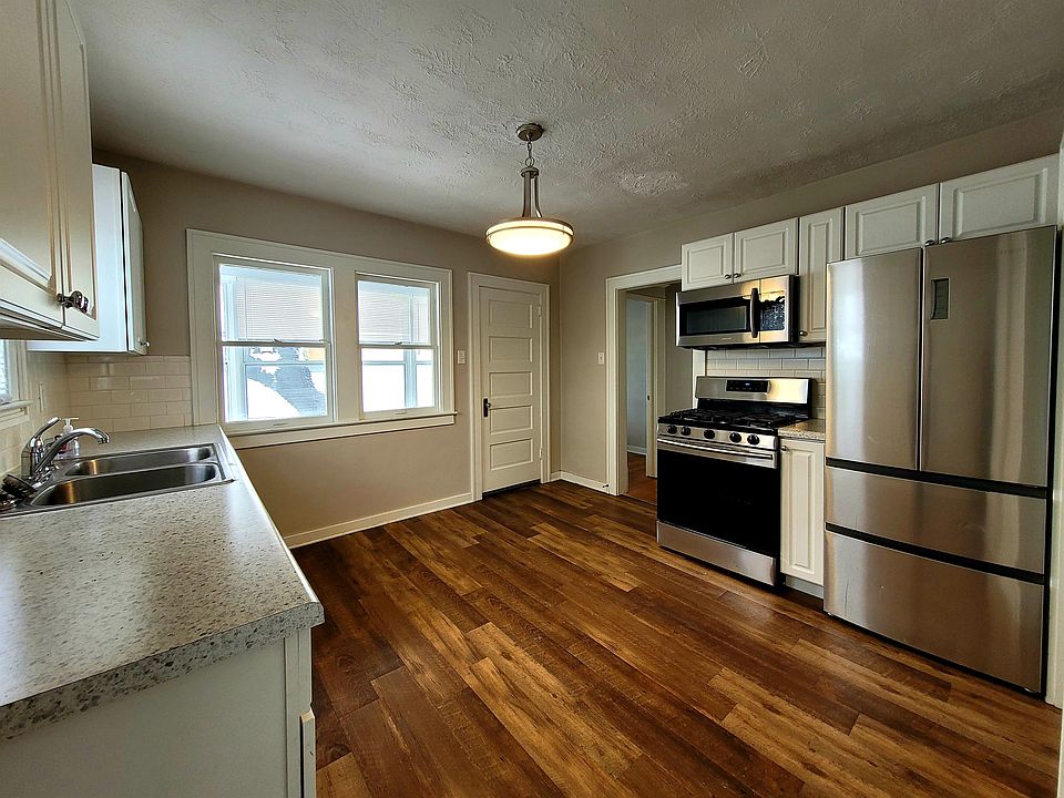 Kitchen with additional storage and enclosed porch space