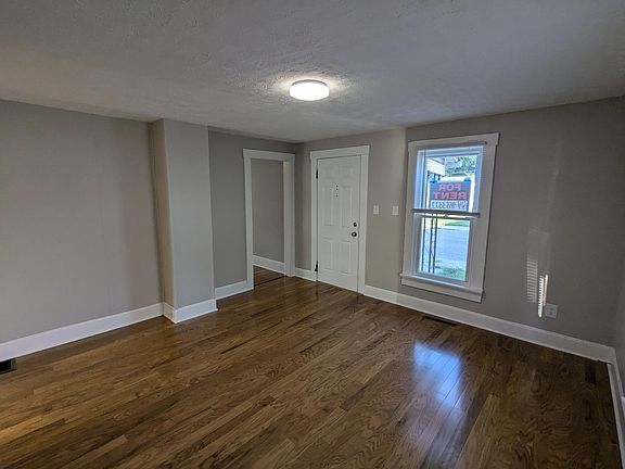 Photo of 1st downstairs room facing front door.