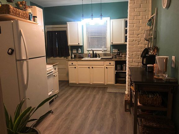 Updated kitchen, with original cast iron sink. New granite, floors. Washer and dry closet not visible
