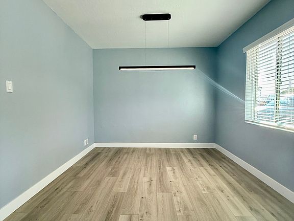 Dining room area w/ new lighting fixture.