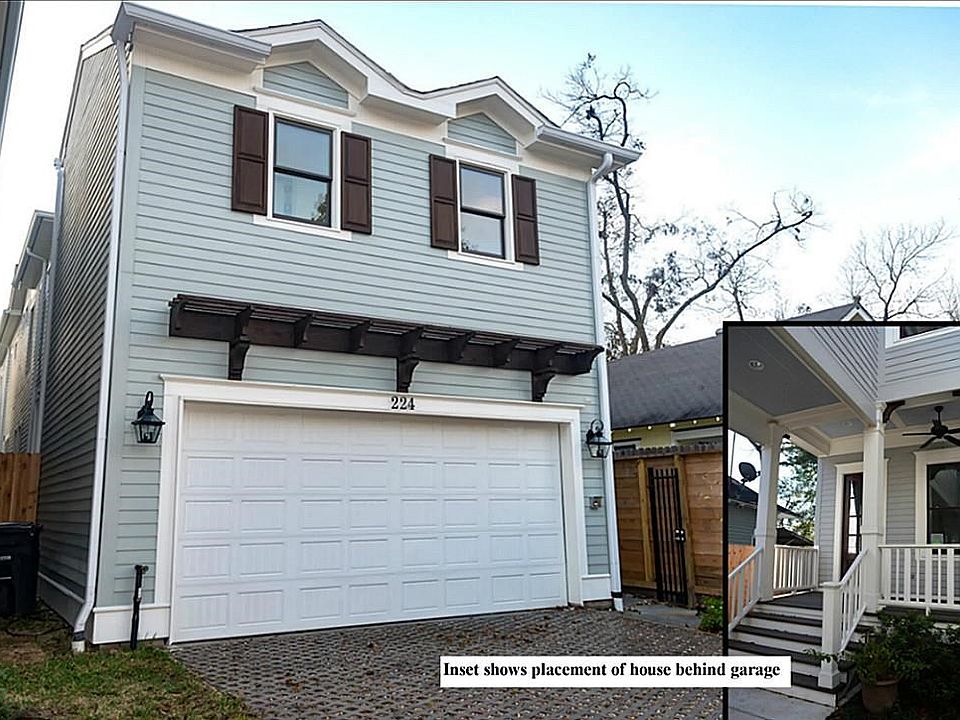 Unique home offers privacy from street. The home sits behind the garage, separated by a courtyard. See inset showing house porch.