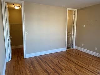 Primary bedroom walk in closet and private bath