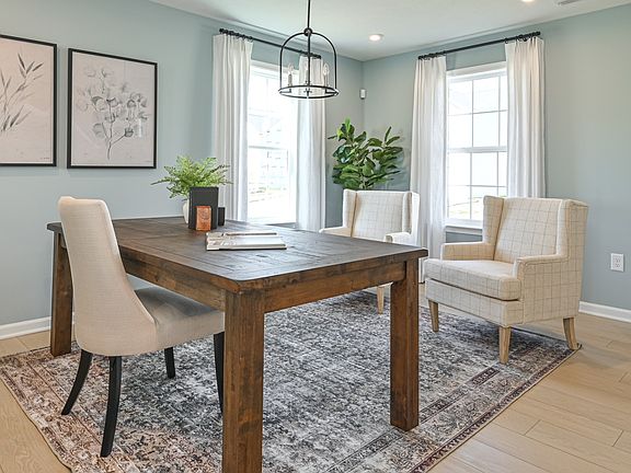 Spacious and open fllex space with light toned wood floors, 2 large windows on adjacent walls, rece