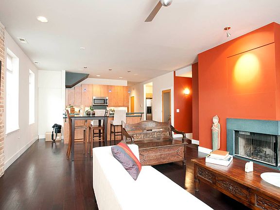 Hardwood Brazilian cherry floors + exposed brick