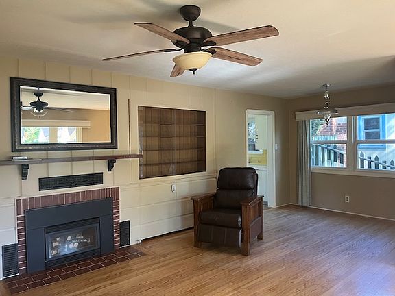 Living Room with gas fireplace and built in shelving
