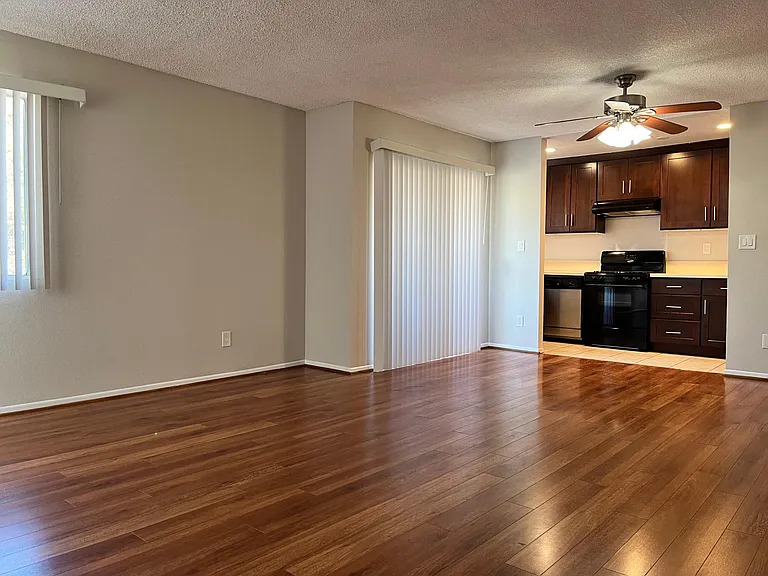 Large open concept living & dining space, with a private balcony