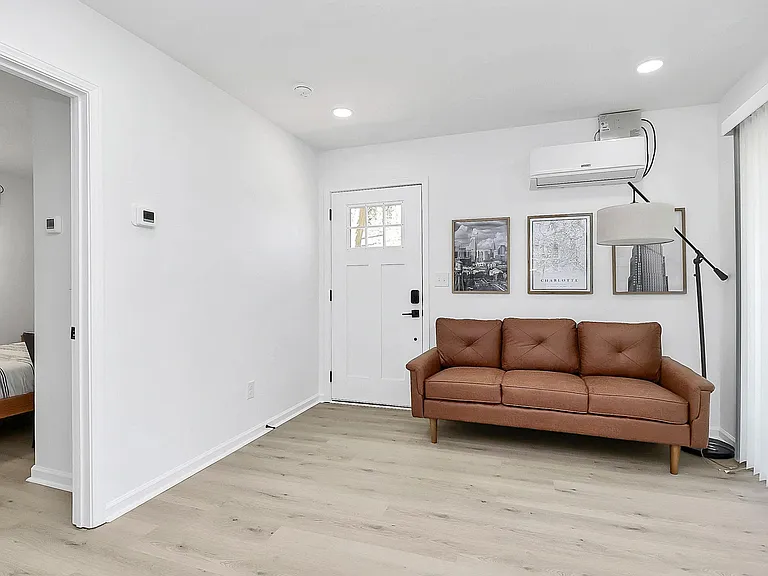 Living room. A 2 seat, fold-down table has been added for dining and working.
