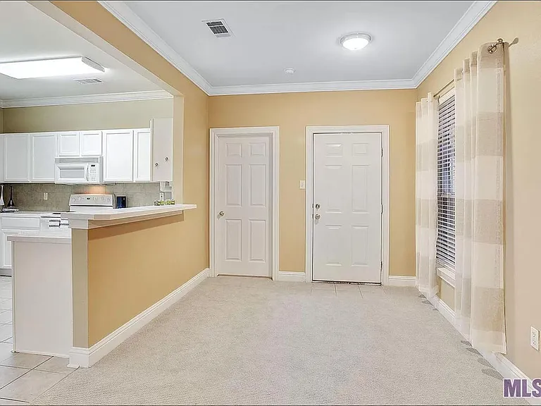 Dining Room w/ door (on right) out to private patio.