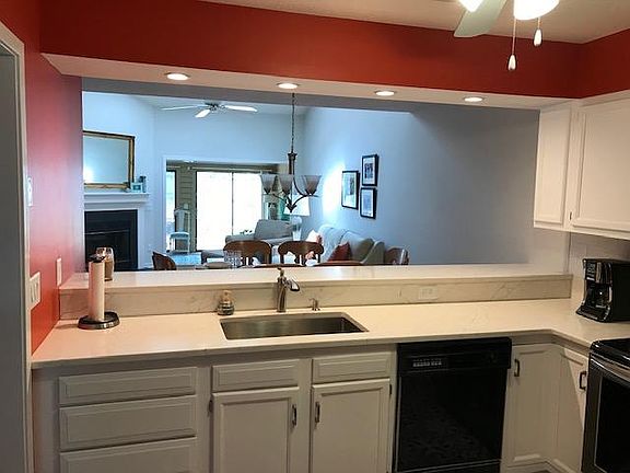 View from kitchen looking into dining/living and sunroom.