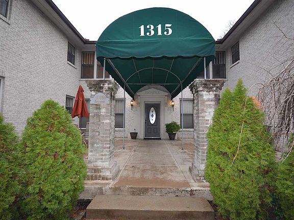 Front door to 1315 Kavanaugh. Apartment 7 is on the right side in the back of the building (upstairs).