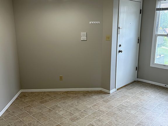 ENTRANCE DOOR AND DINING AREA