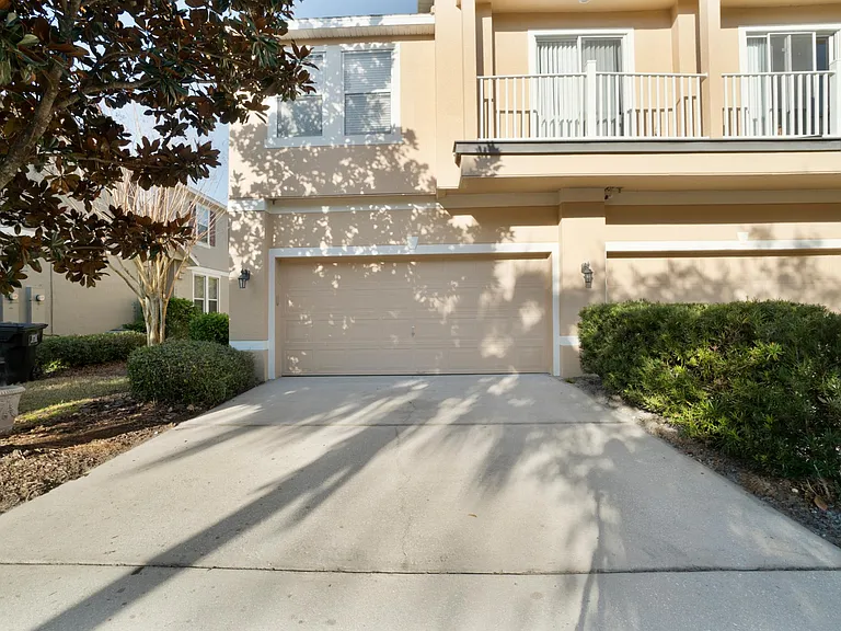 Back garage entrance.
Balcony in photo is neighboring unit