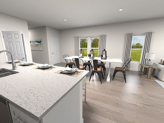 Large island overlooks dining area.