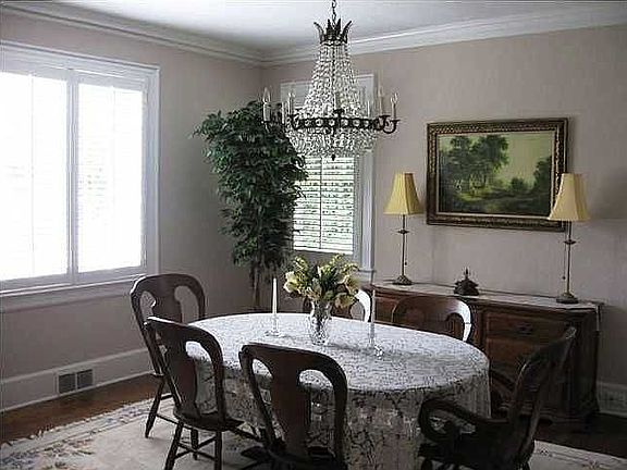 Formal dining room - 15x13, plantation shutters, hardwood floors